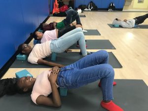 students doing yoga