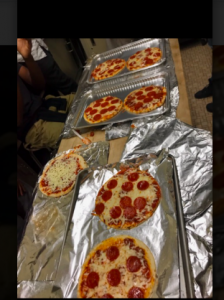 students cooking pizza